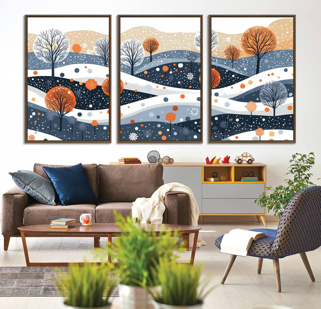 The "Abstract Winter Landscape Canvas Wall Art Print," featuring a triptych of landscapes with trees and hills in vibrant orange, white, and blue hues, adds a gallery-quality finish that transforms the space into an art lover's dream.