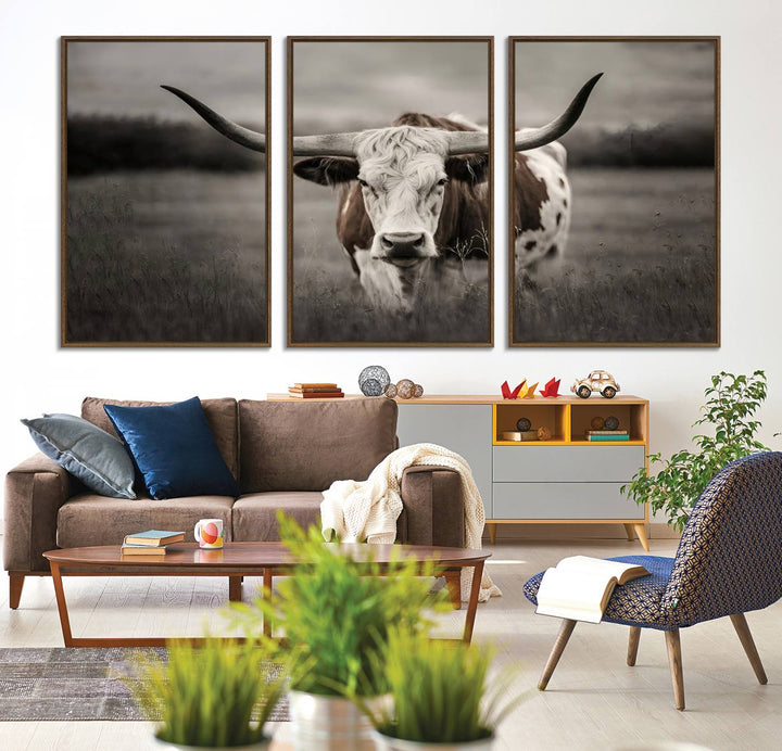 The Texas Longhorn Cow Canvas Wall Art Print adds a rustic touch to a living room.