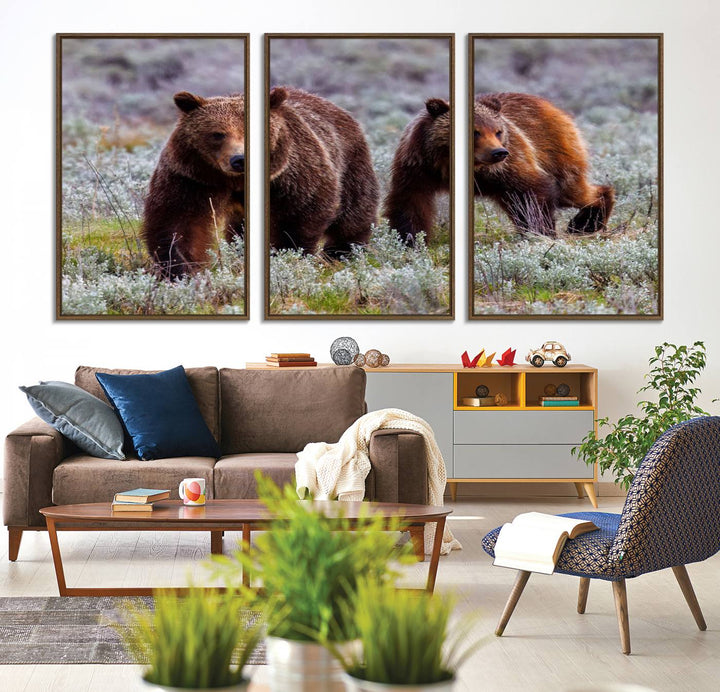 The "Queen of the Tetons" is a stunning canvas art print featuring Grizzly 399 and two bears strolling through a grassy field. Its gallery-quality finish beautifully captures the essence of nature, making it perfect for rustic home decor.