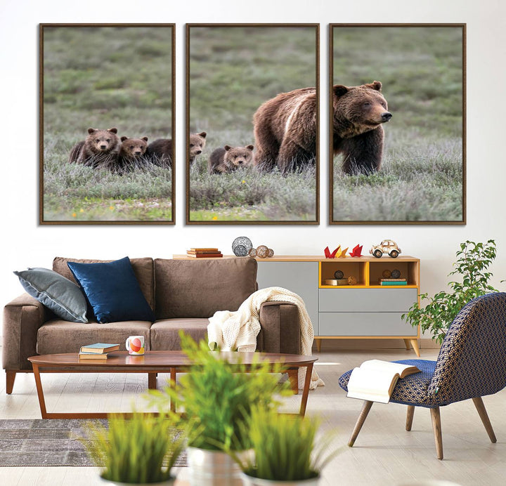 The large canvas print titled "Queen of the Tetons, 399 Grizzly Bear Cubs" showcases majestic wildlife photography of a bear and her cubs walking through the grass. This stunning canvas wall art, handmade in the USA, adds a charming touch to any room with its rustic decor appeal.