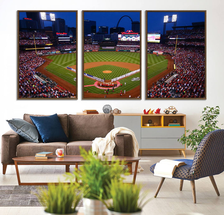 A Cardinals wall art canvas print depicts Busch Stadium with players lined up on the field and a full audience under the lights, capturing the vibrant atmosphere.