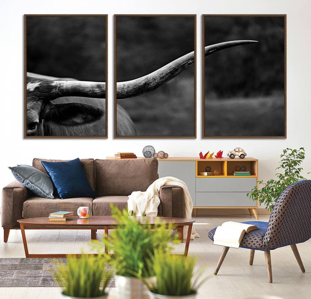 Cow Longhorn Wall Art: This black and white print adds rustic charm.