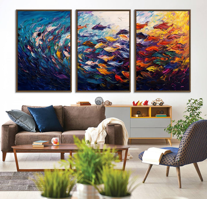 The Vibrant Abstract Fish Swarm Art features a colorful 3-piece canvas that adds a pop of color.