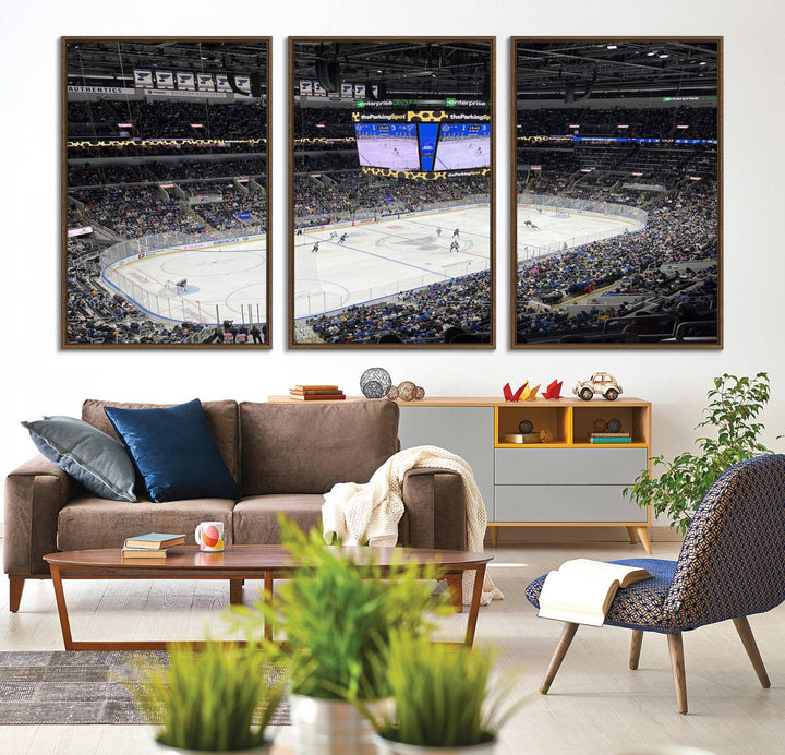 A large Enterprise Center canvas of a crowded hockey arena hangs prominently.