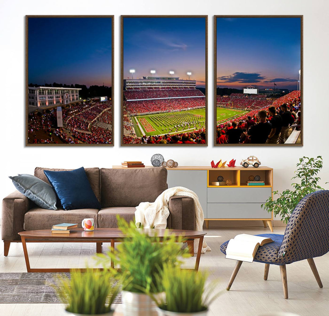 A vibrant and dynamic painting captures the essence of an electrifying night game at Carter-Finley Stadium, highlighting the illuminated atmosphere as the NC State Wolfpack competes under bright stadium lights.