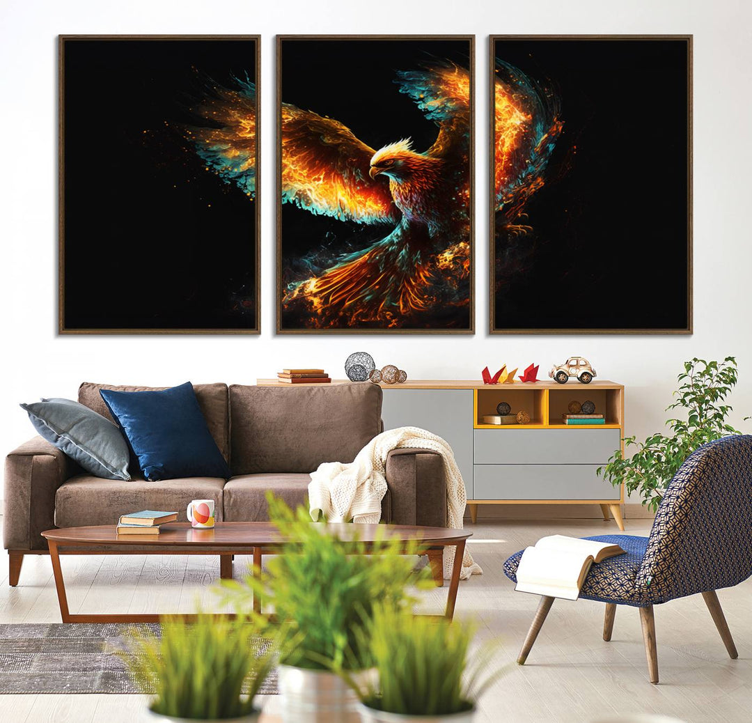 The Fiery Phoenix Canvas Print, showcasing a majestic bird with fiery wings against a black background, makes for the perfect bold decor in your living room.