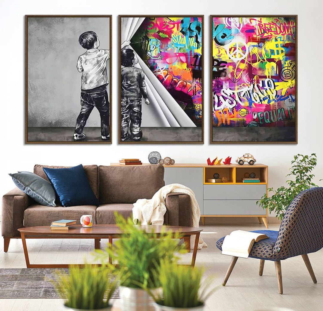 The Banksy Print - Street Art Canvas features a vibrant and bold image of two children lifting a curtain to reveal colorful graffiti. It's ready to hang, adding an urban modern decor vibe.