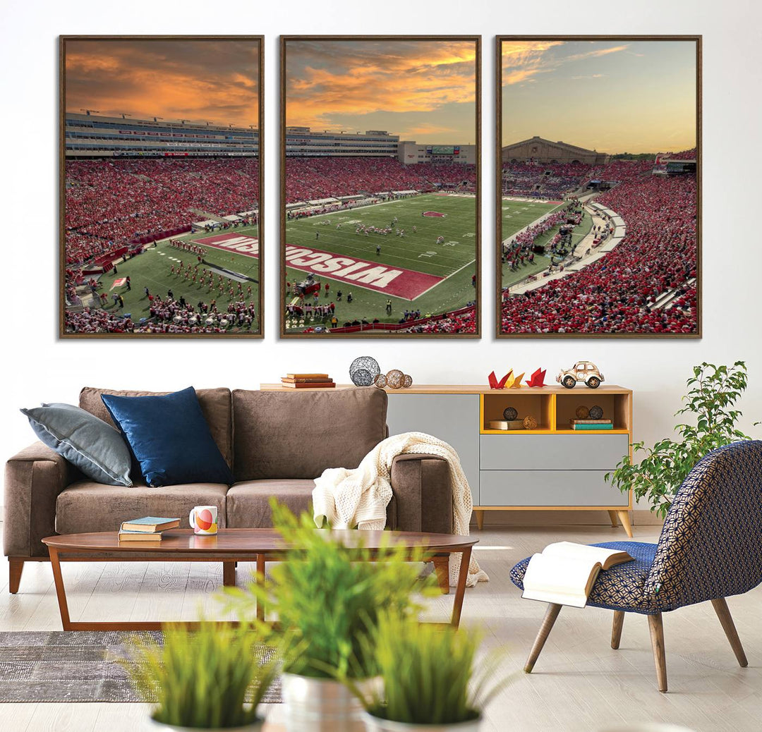 The wall features a Wisconsin Badgers wall art canvas print, capturing the vibrant atmosphere of a full Camp Randall Stadium at sunset.