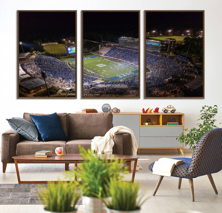 Night aerial view of packed Duke Blue Devils Wallace Wade Stadium, surrounded by trees and illuminated by lights; perfect for high-resolution prints.