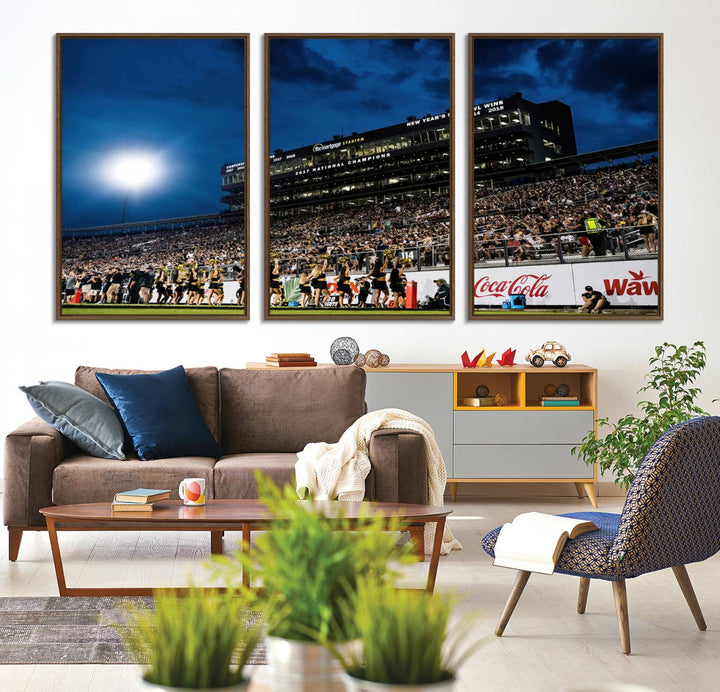 A gallery-quality canvas print depicting a stadium packed with fans under a night sky, highlighting the UCF Knights Football Team.