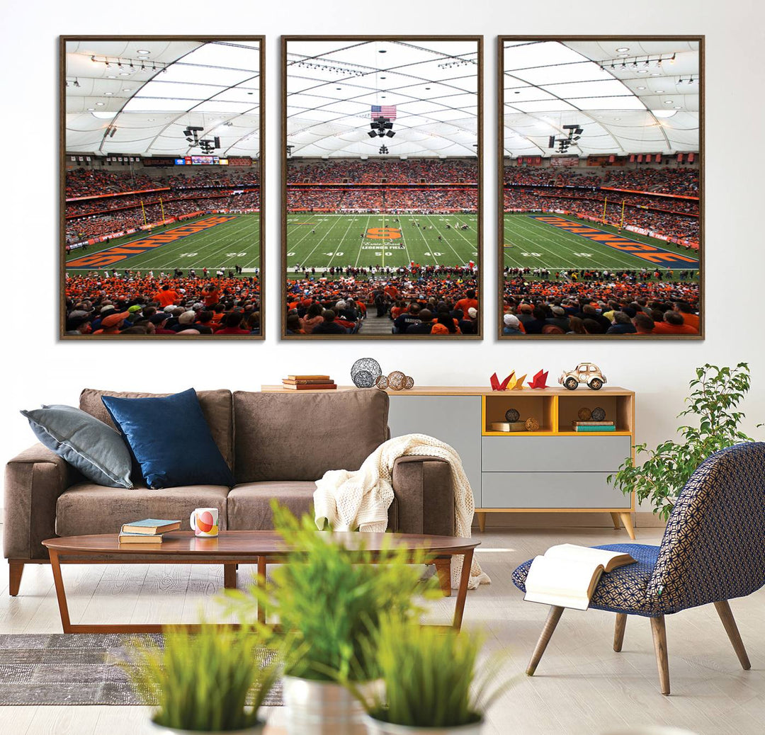 Fans fill the Syracuse JMA Wireless Dome, highlighted in orange and blue under a vaulted roof on this premium canvas print of the scene.