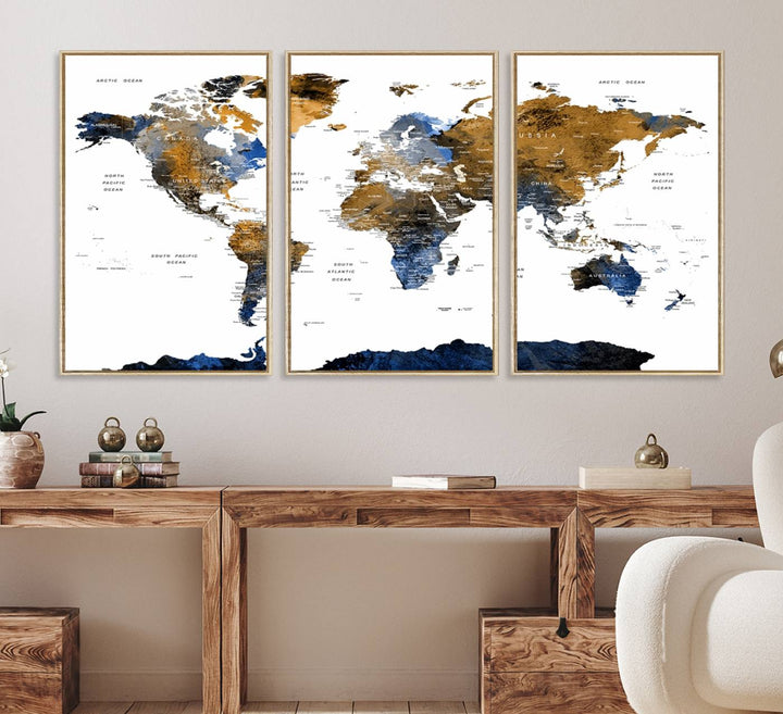 The Watercolor World Map Canvas showcases a grunge-stained background in gold, gray, and blue hues.