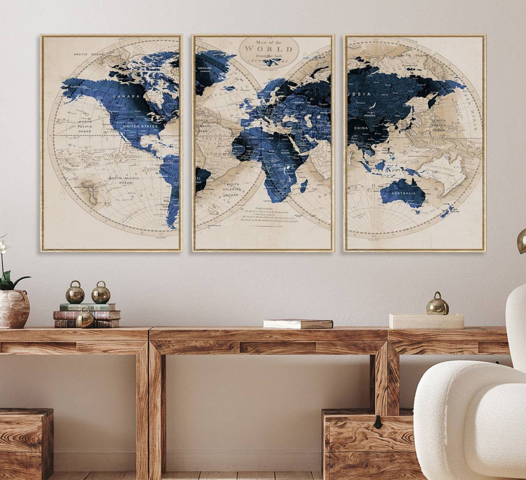 The Vintage Triptych Map Print is a grunge-stained blue and beige world map, perfect for enhancing wall decor.
