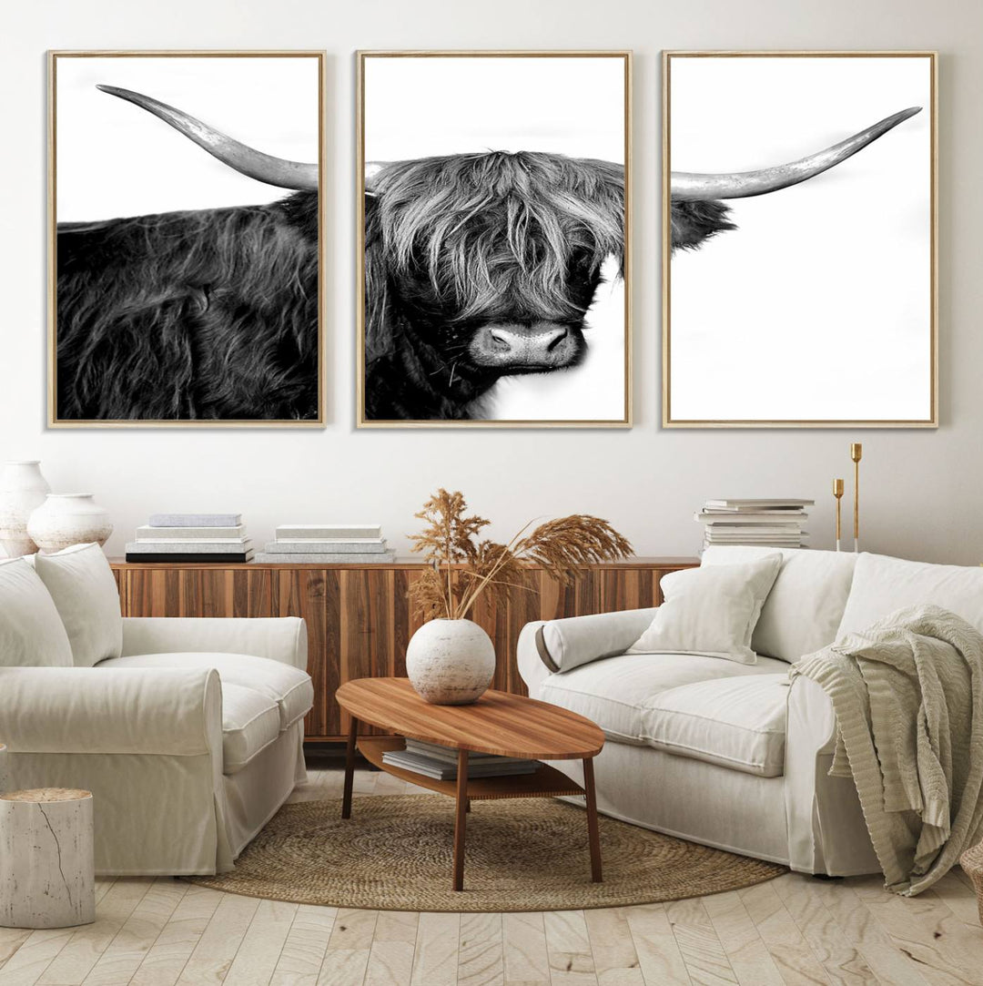 The Black and White Highland Cow Multi Panel Wall Art Canvas Print with UV-protection hangs prominently.