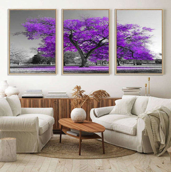 The Big Purple Tree Wall Art Canvas Print showcases a vibrant purple tree set against a black-and-white landscape.