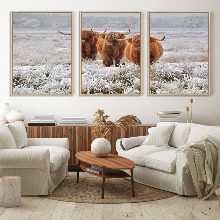 The Highland Cows in Snow canvas showcases three cattle in a frosty field.