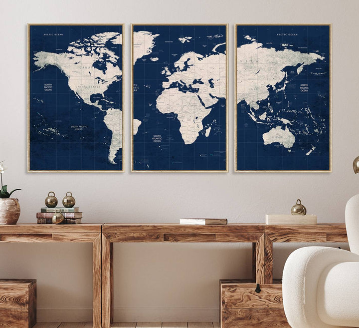 Large modern world map wall art canvas print in beige and navy; showcases a 3-panel vintage map design and is ready to hang.