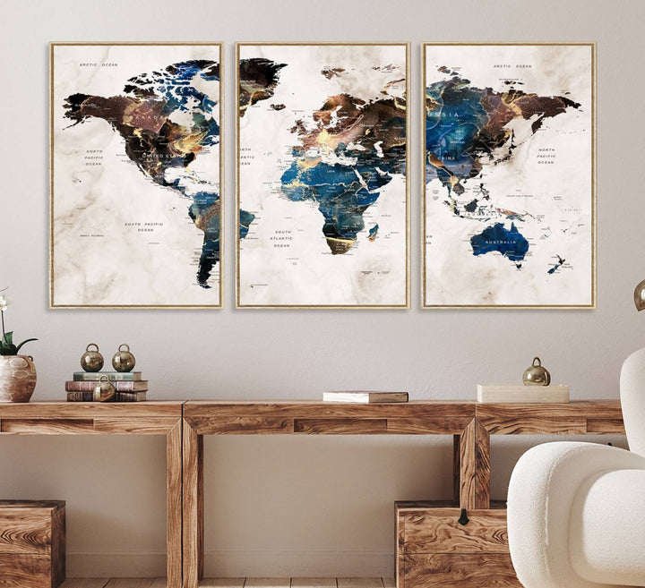 Abstract earth-toned 3-panel world map wall art featuring blues and browns, ready to hang; it showcases continents on modern canvas.