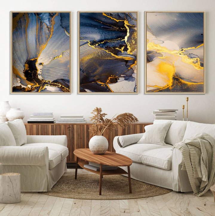 A modern luxury kitchen features a large gold and blue abstract canvas wall art print.