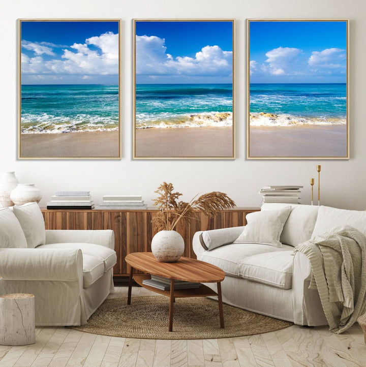 The Tropical Beach 3-Panel Canvas Wall Art features ocean waves gently lapping on a beach under blue skies, making it an ideal choice for coastal decor.