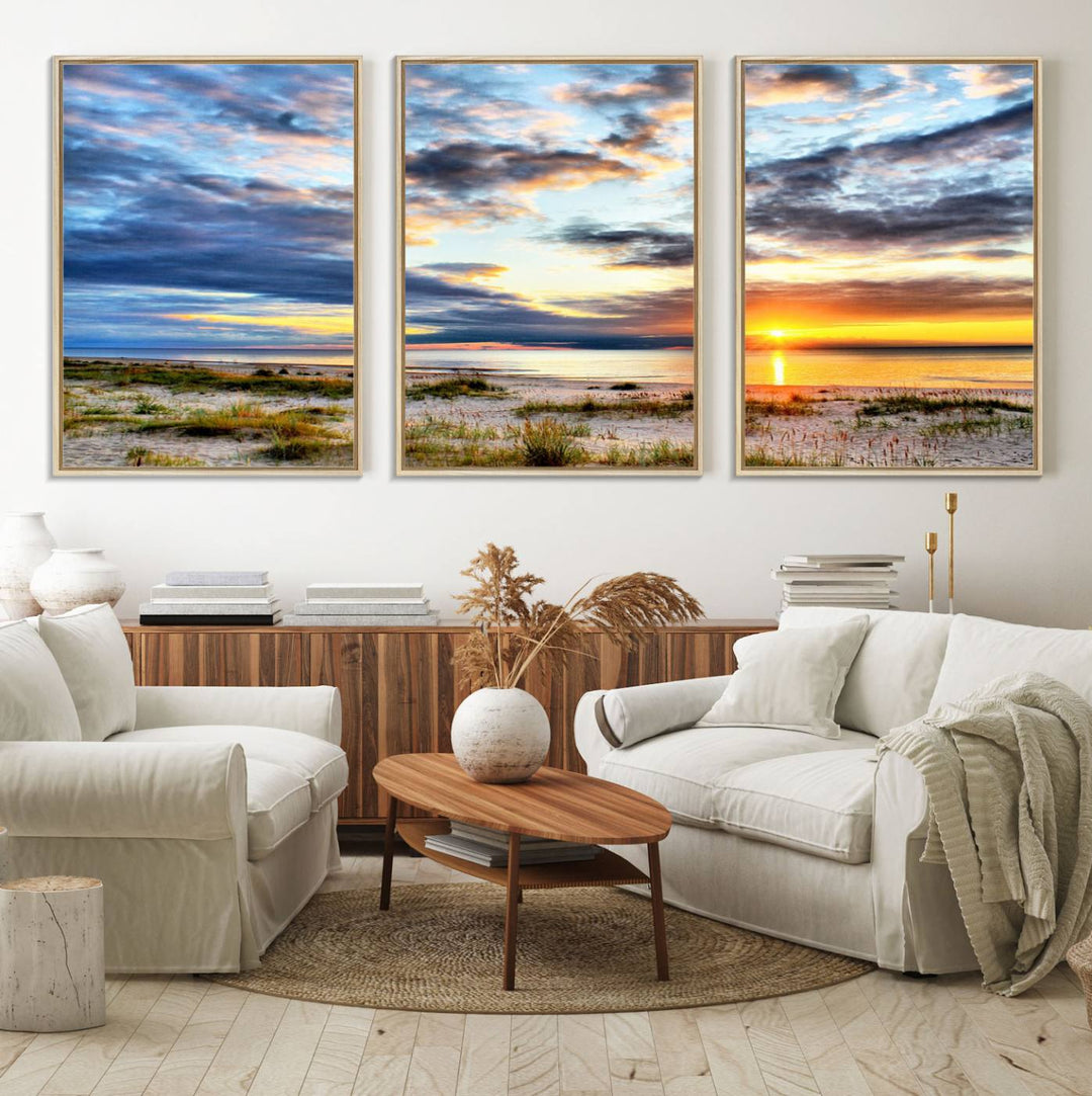 The Sunset On The Ocean canvas wall art features a beautiful beach sunset with grass and clouds.