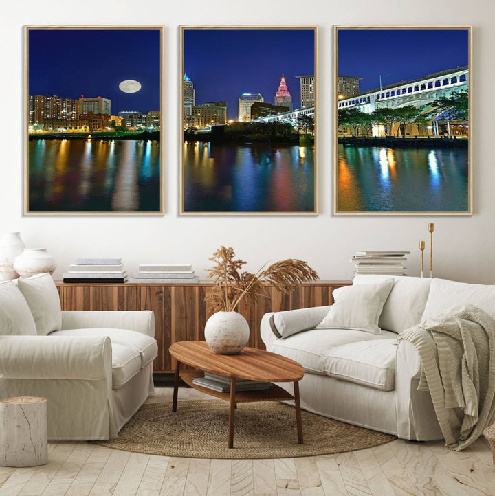 Cleveland City Lights Night Skyline Wall Art canvas showcases a moonlit cityscape reflected on water.