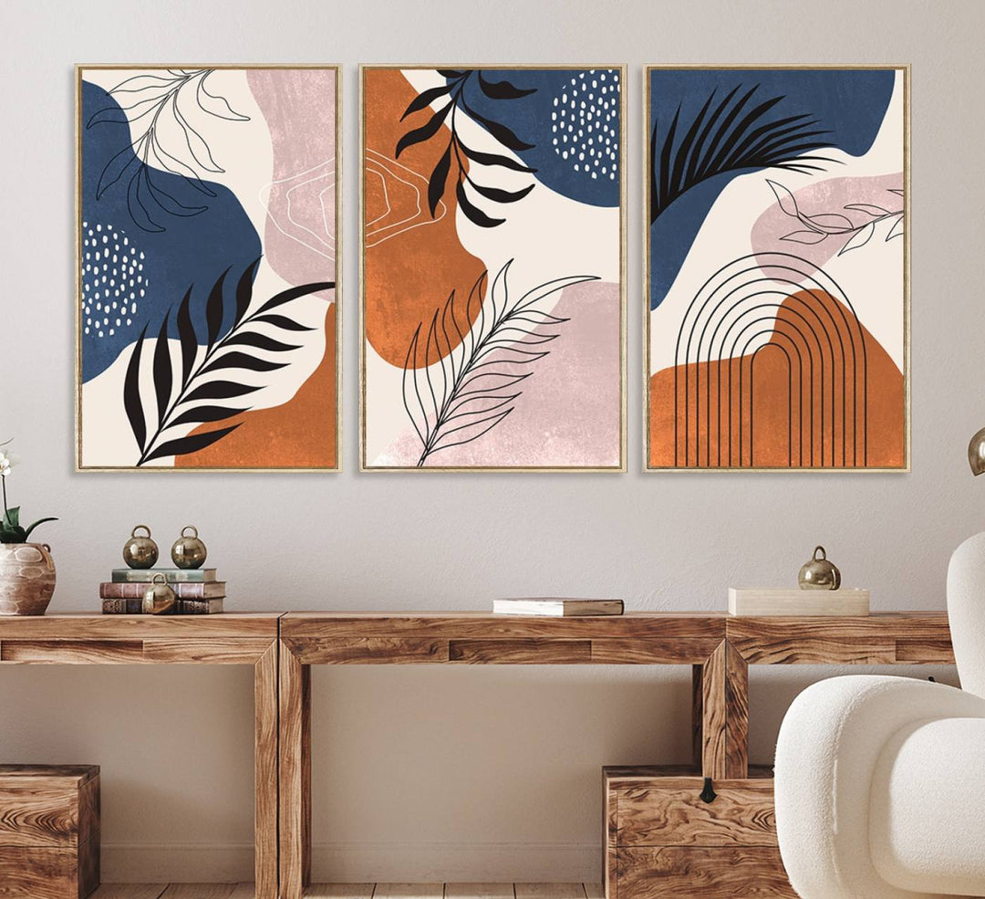 Boho Wall Art Canvas Print Set showcases mid-century geometric and leaf motifs in blue, ochre, and pink.