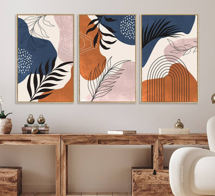 Boho Wall Art Canvas Print Set showcases mid-century geometric and leaf motifs in blue, ochre, and pink.