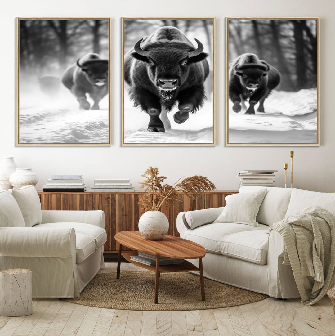 The Buffalo Wall Art Canvas Print of bison running through snow adorns the wall.