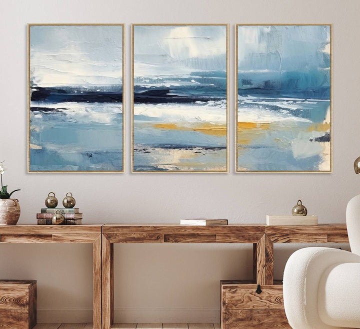 The Abstract Ocean Canvas Wall Art in coastal blue and gold enhances the modern kitchen.