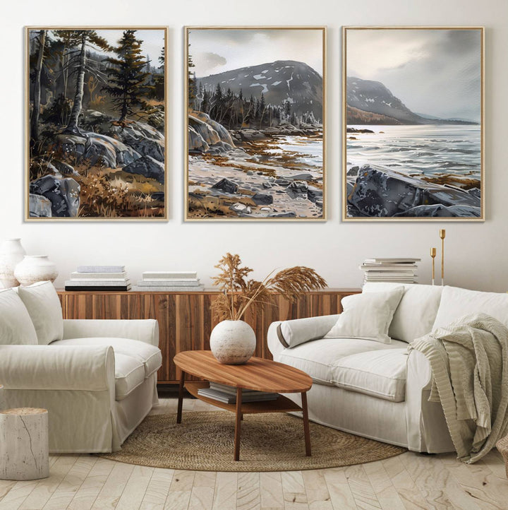 Framed wall art depicting Acadia National Parks rocky coast, trees, mountains, and sunlight over the sea; ready to hang.