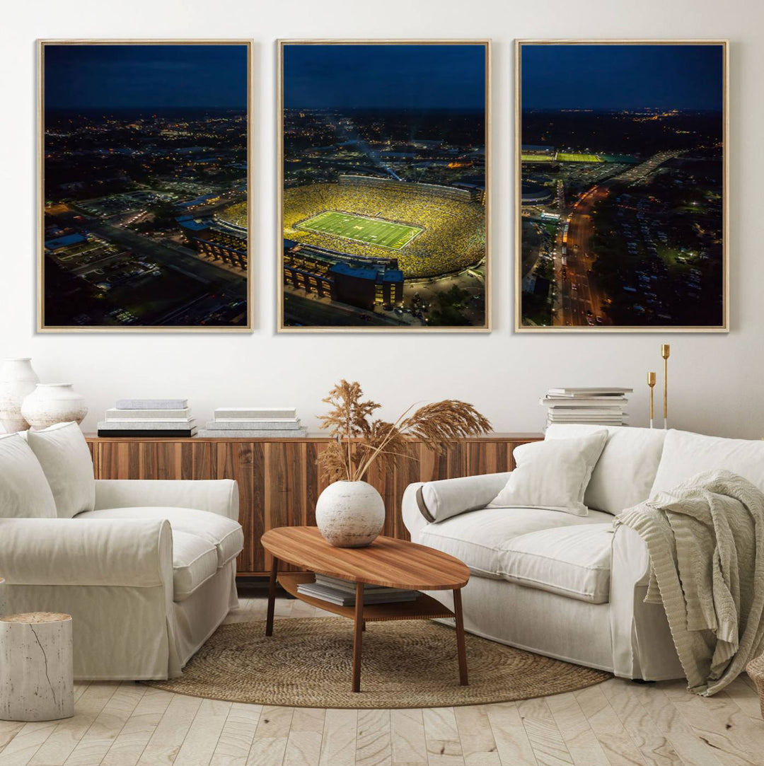 Aerial view of Michigan Stadium at night, surrounded by city lights, depicted on a Michigan Wolverines wall art canvas print.