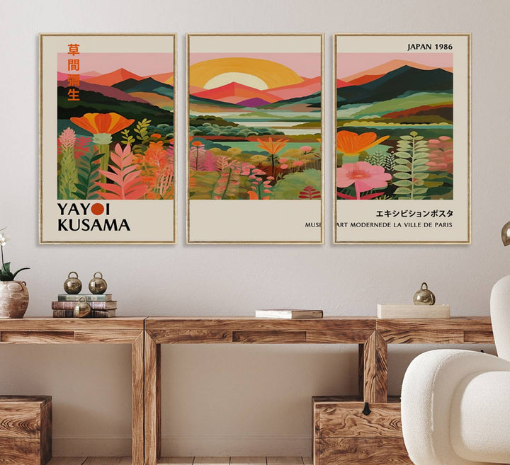 The Yayoi Kusama Landscape Canvas Print, featuring vibrant floral mountains and sunset scenery, enhances the room.