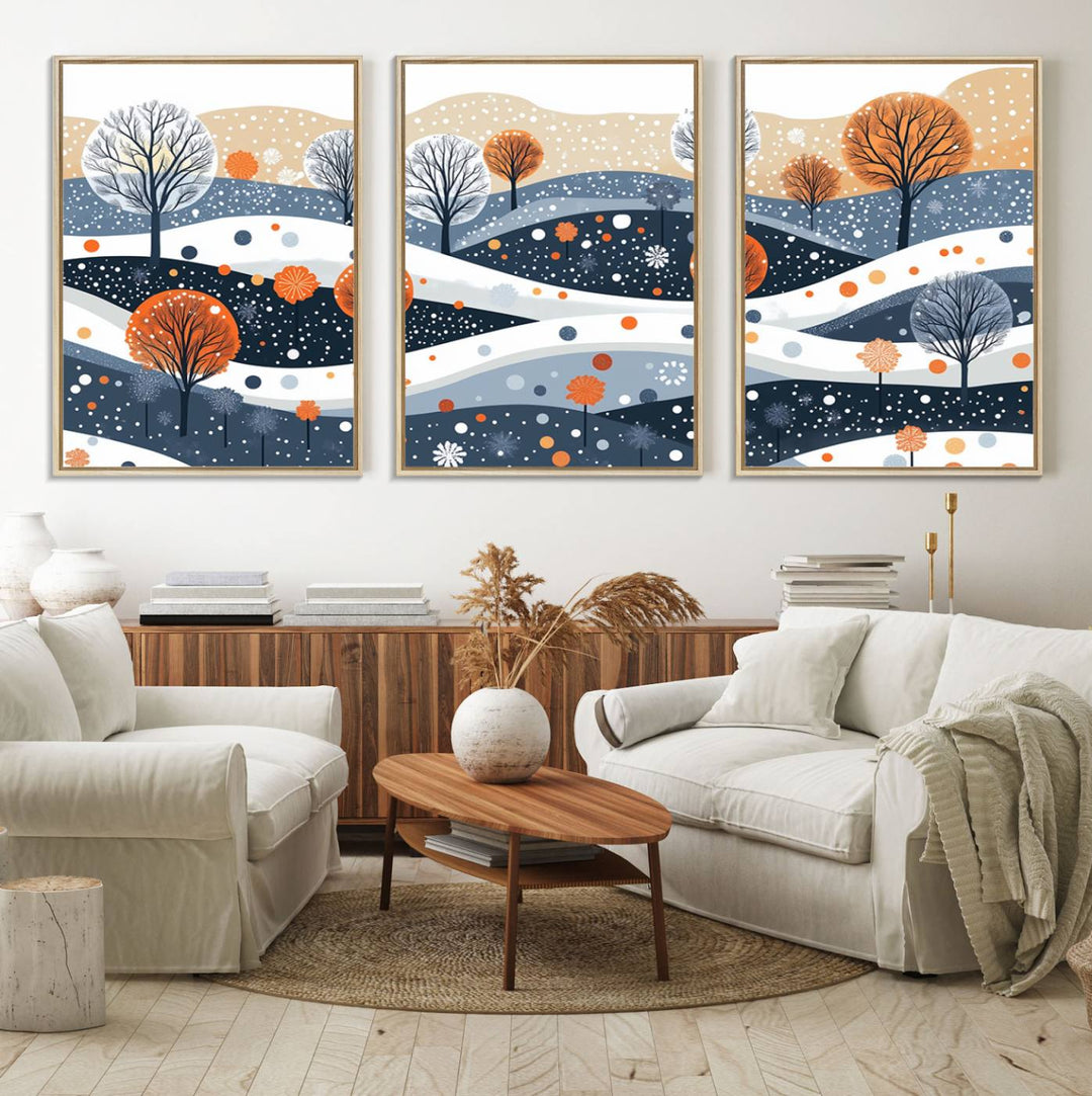 The "Abstract Winter Landscape Canvas Wall Art Print," featuring a triptych of landscapes with trees and hills in vibrant orange, white, and blue hues, adds a gallery-quality finish that transforms the space into an art lover's dream.