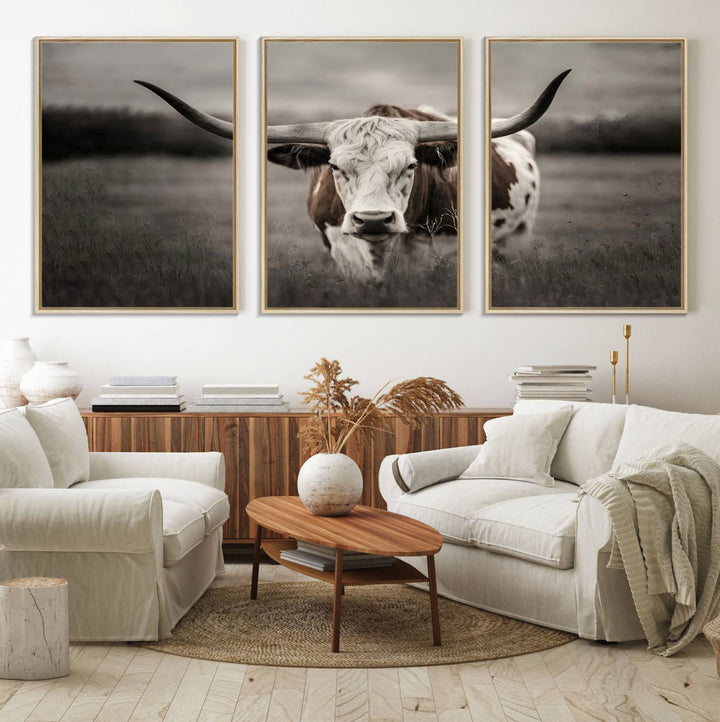 The Texas Longhorn Cow Canvas Wall Art Print adds a rustic touch to a living room.