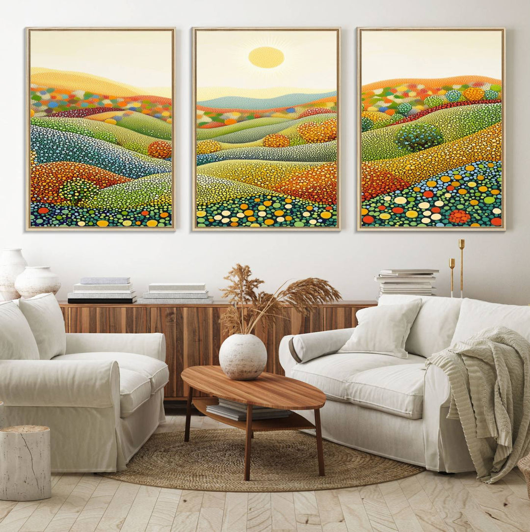 The YAYOI KUSAMA Colorful Dot Art Landscape Canvas, a framed abstract pointillism piece inspired by nature featuring vibrant rolling hills and a sun, adds gallery-quality elegance to your living space.