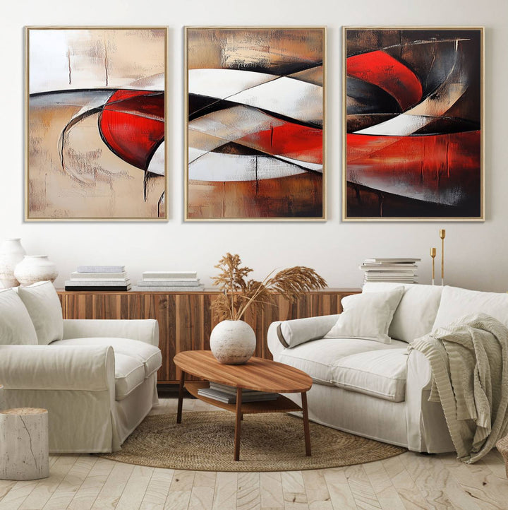 The "Abstract Wall Art - Modern Red and White Canvas Wall Art Print" features bold geometric shapes in red, black, and white on a beige background, enhancing contemporary aesthetics. This canvas print adds a striking focal point to any room, beautifully complementing the modern vibe of the space.