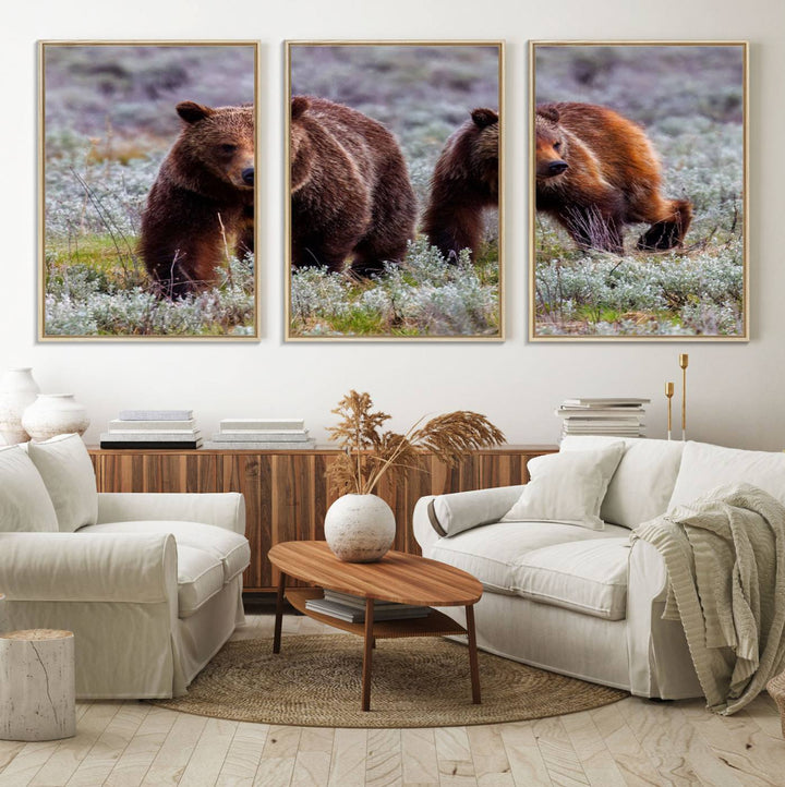 The "Queen of the Tetons" is a stunning canvas art print featuring Grizzly 399 and two bears strolling through a grassy field. Its gallery-quality finish beautifully captures the essence of nature, making it perfect for rustic home decor.