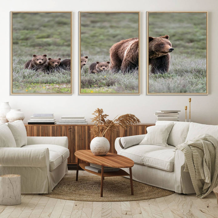 The large canvas print titled "Queen of the Tetons, 399 Grizzly Bear Cubs" showcases majestic wildlife photography of a bear and her cubs walking through the grass. This stunning canvas wall art, handmade in the USA, adds a charming touch to any room with its rustic decor appeal.