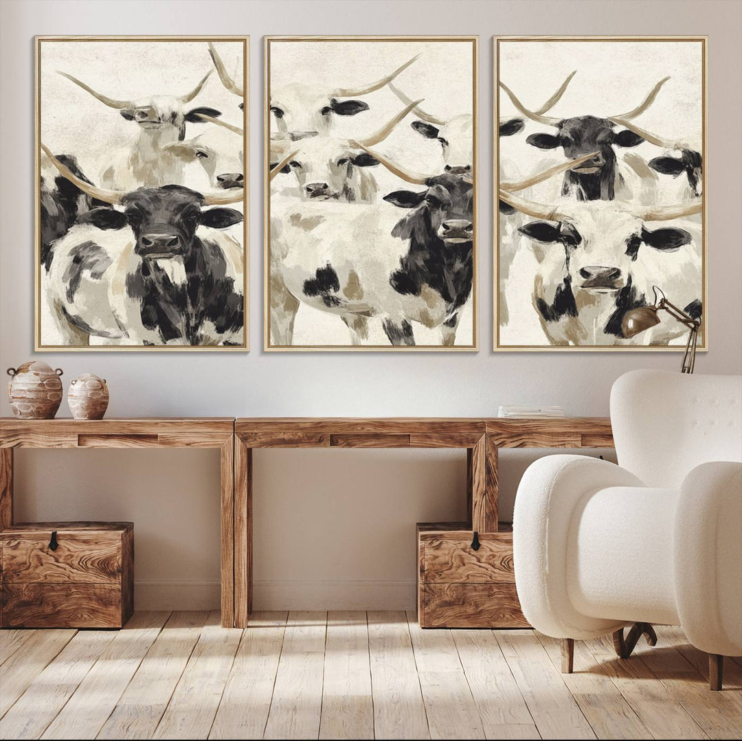 Canvas print titled Longhorn Texas Cow Drawing, depicting longhorn cattle with black and white markings, made in the USA, displayed on the wall.