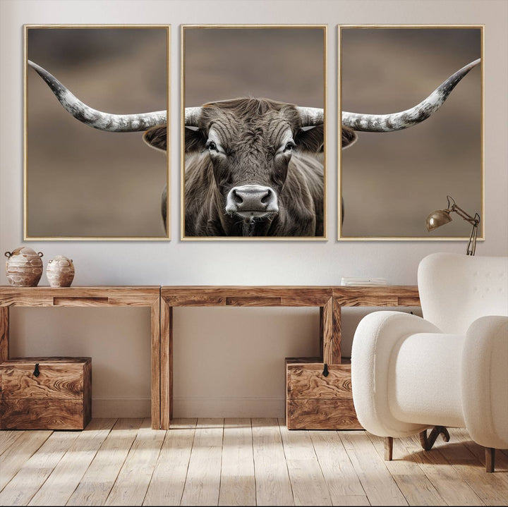 A close-up of a longhorn bull facing forward is featured in the Framed Texas Test-1, set against a blurred brown background.