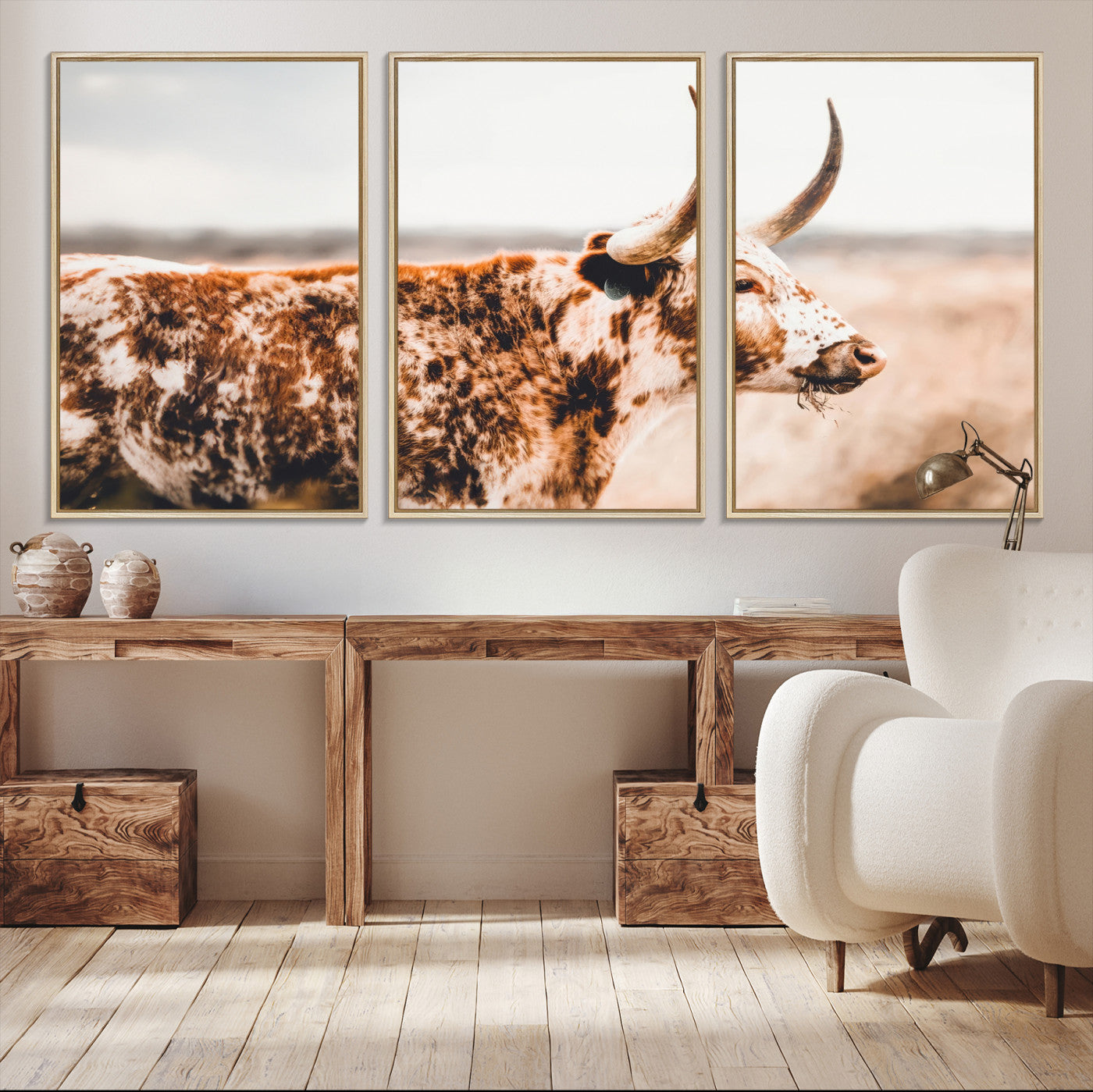 Speckled Texas longhorn with curved horns standing in a warm-toned prairie, perfect for rustic or country-style home decor.