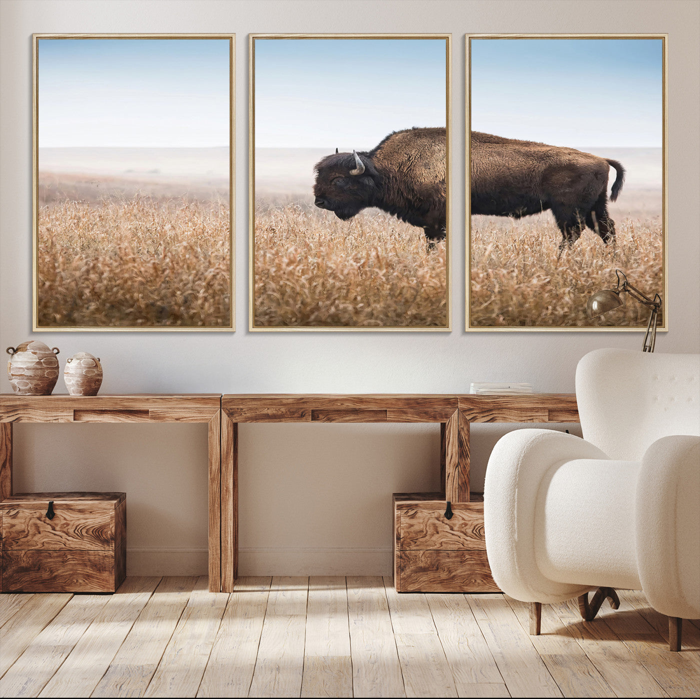 A solitary American bison stands in a dry grassland under soft skies, ideal for rustic or western-style home decor in warm neutral tones.