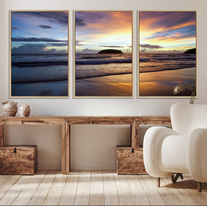 A tropical beach at sunset with waves gently washing ashore, reflecting golden and purple hues in the sky, creating a tranquil coastal scene.