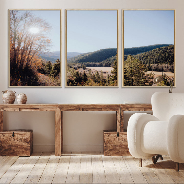 A scenic mountain valley with pine trees and autumn foliage under a clear sky, bathed in golden sunlight, creating a peaceful and rustic landscape.