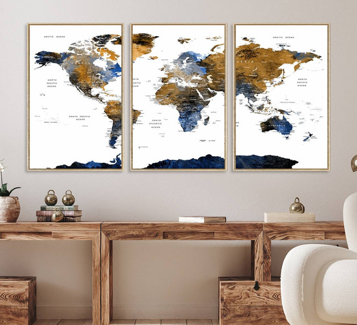The Triptych Modern World Map Canvas in blue and brown is an ideal global decor piece for enhancing living rooms or offices. It comes ready to hang.