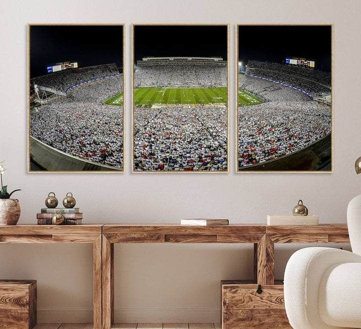 The triple canvas wall art depicts Beaver Stadiums vibrant atmosphere during a night game from the end zone.