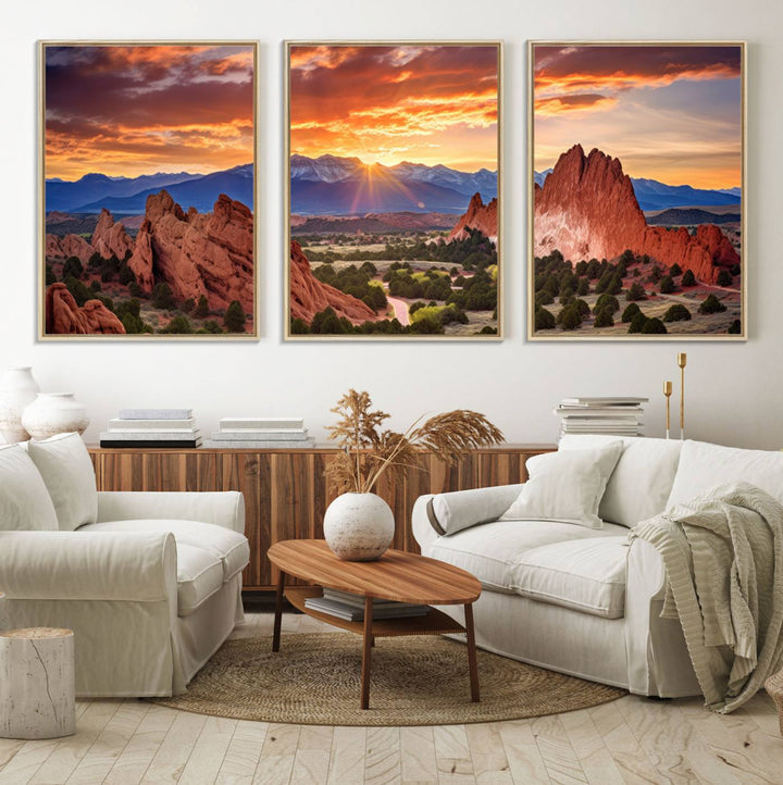 A vibrant sunset over the Rocky Mountains with red rocks.