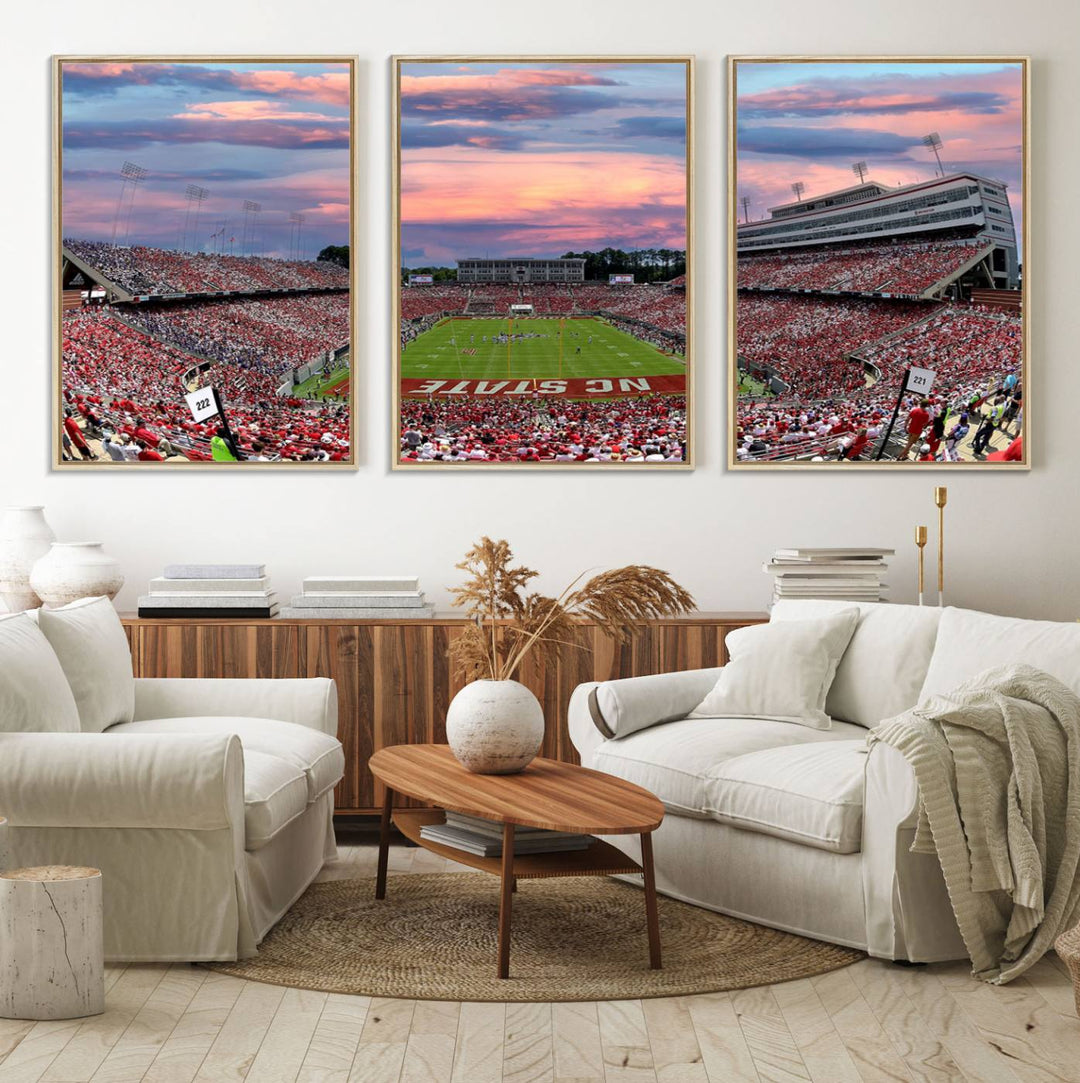 The wall art captures an NC State Wolfpack game under a vibrant sunset on triple canvas.