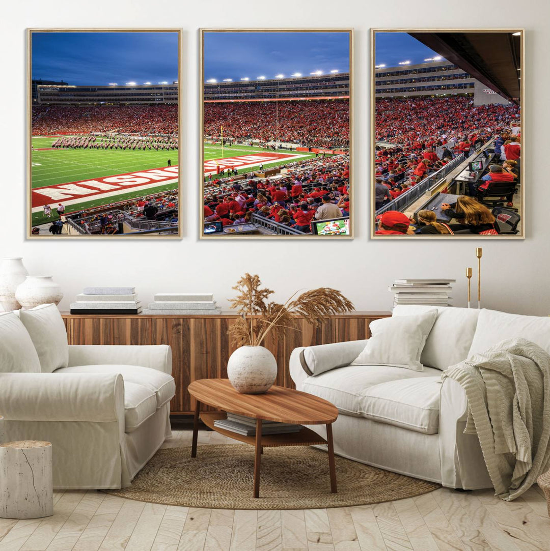 A vibrant wall art captures the essence of Madison Camp Randall Stadium, depicting a sea of fans in red and white during a Wisconsin Badgers football game under bright lights.